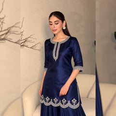 Close-up of silver embellishment on navy Shamoz silk shirt