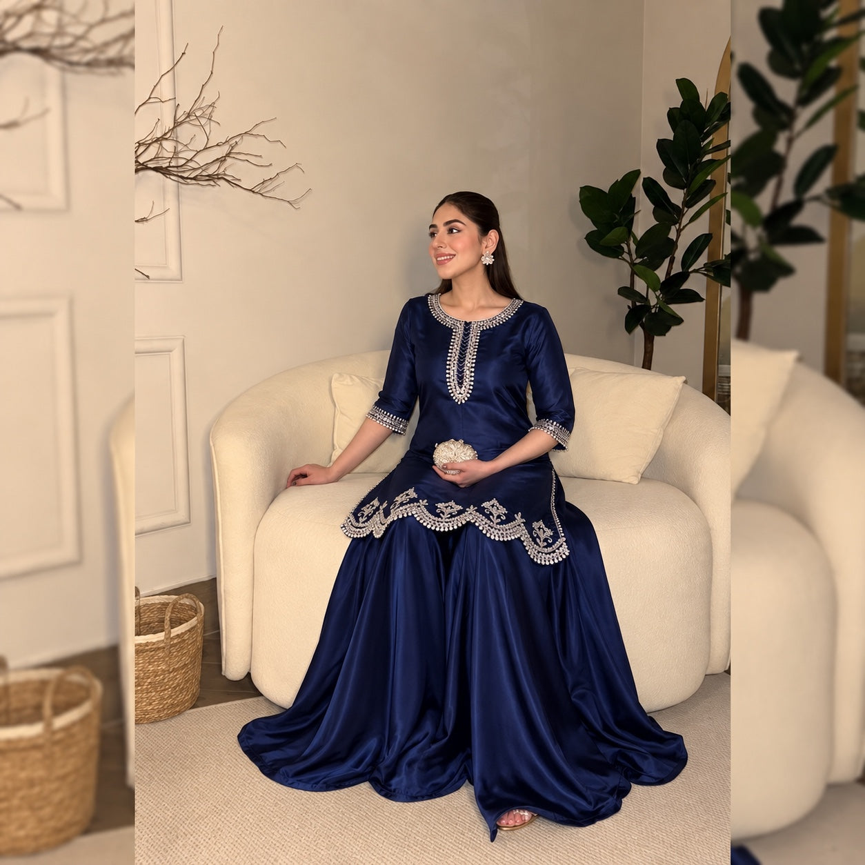 Model wearing the navy Shamoz silk set while seated
