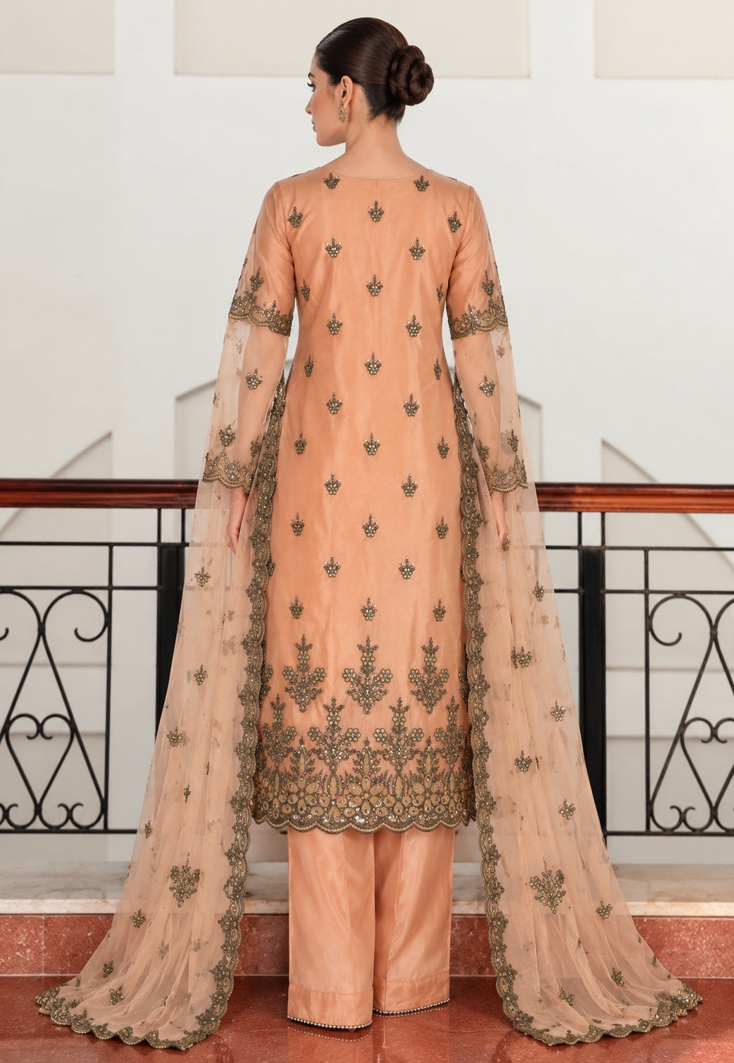 Peach embroidered suit back view with net dupatta