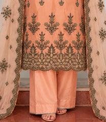 Peach suit embroidered hem and trouser detail